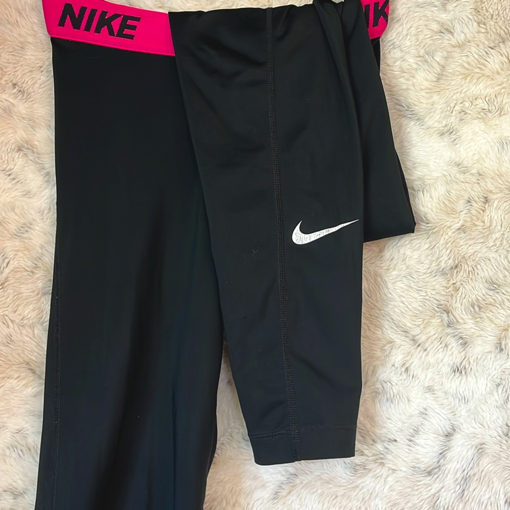 Black Nike leggings with pink waistband